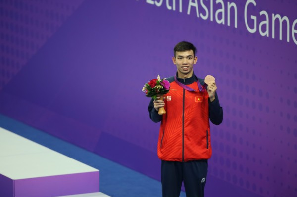Giành hai huy chương đồng ASIAD 19, Huy Hoàng đặt mục tiêu khiêm tốn tại Olympic 2024 - Ảnh 2.