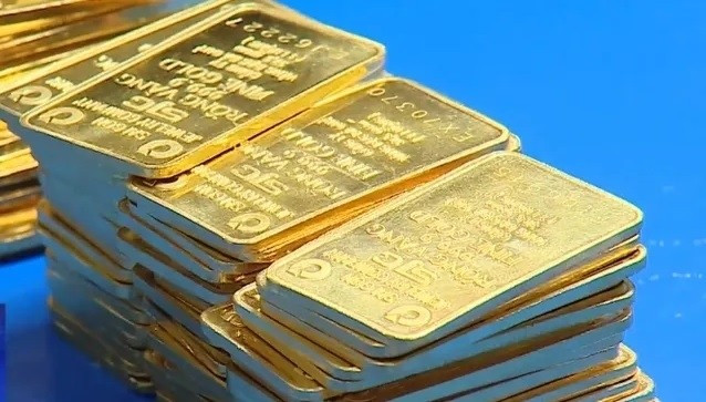 Vàng thu hẹp đà tăng khi căng thẳng thuế quan hạ nhiệt - Ảnh 1.