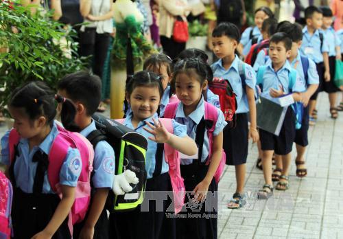 Học sinh lớp 1 trường Tiểu học Đinh Tiên Hoàng, quận 1 trong ngày tựu trường. Ảnh: Phương Vy/TTXVN