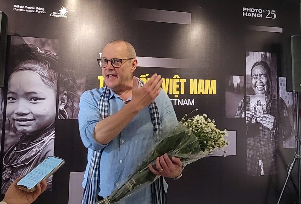 Triển lãm ảnh tái hiện hơn ba thập kỷ đổi thay của Việt Nam - Ảnh 1. Triển lãm ảnh tái hiện hơn ba thập kỷ đổi thay của Việt Nam - Ảnh 1.