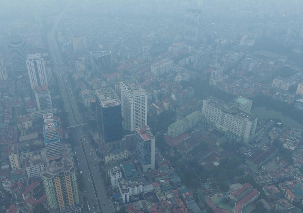 Hà Nội siết chặt kiểm soát bụi mịn từng bước nâng cao chất lượng không khí - Ảnh 1. Hà Nội siết chặt kiểm soát bụi mịn từng bước nâng cao chất lượng không khí - Ảnh 1.
