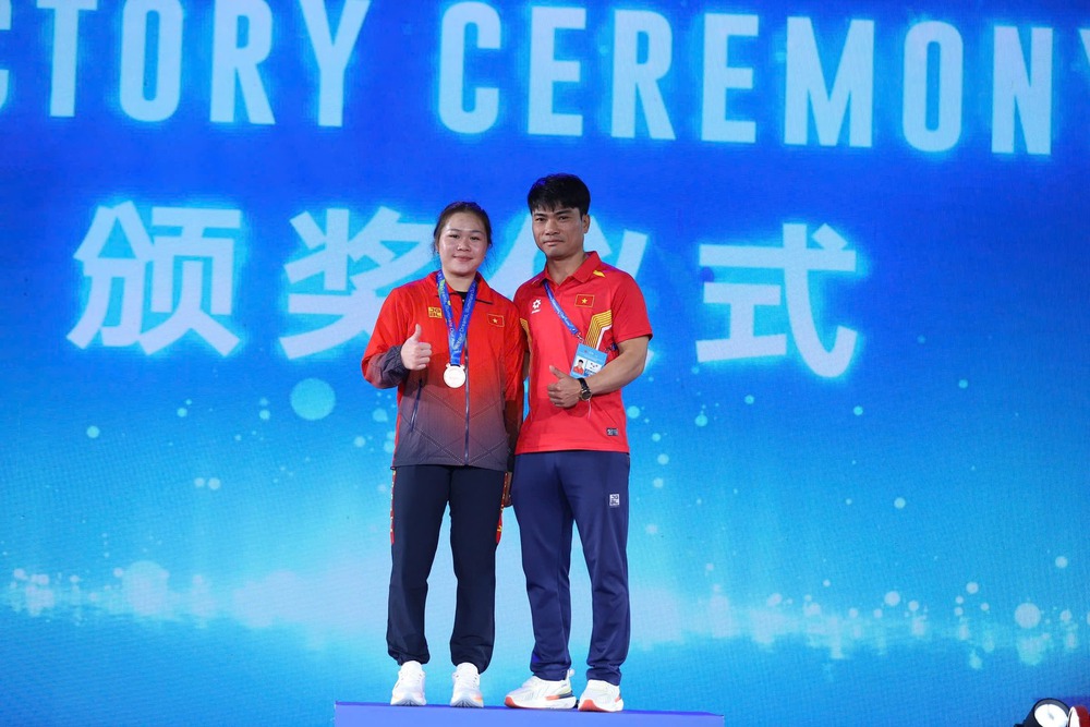 Nữ lực sĩ Việt Nam xuất sắc vượt qua nhà vô địch Olympic, giành huy chương đấu trên đất Trung Quốc - Ảnh 1. Nữ lực sĩ Việt Nam xuất sắc vượt qua nhà vô địch Olympic, giành huy chương đấu trên đất Trung Quốc - Ảnh 1.