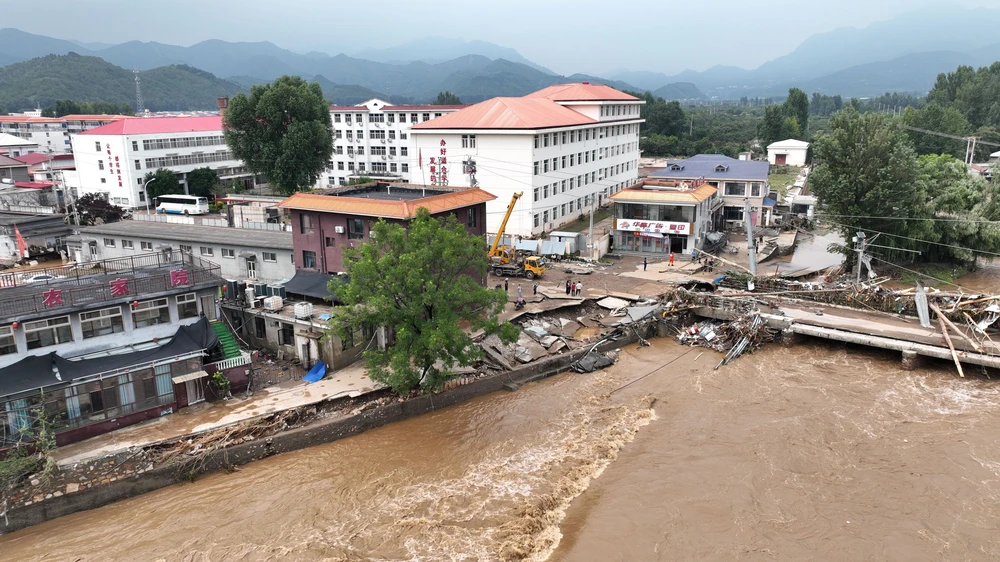 Trung Quốc kích hoạt ứng phó lũ lụt ở nhiều khu vực - Ảnh 2. Trung Quốc kích hoạt ứng phó lũ lụt ở nhiều khu vực - Ảnh 2.