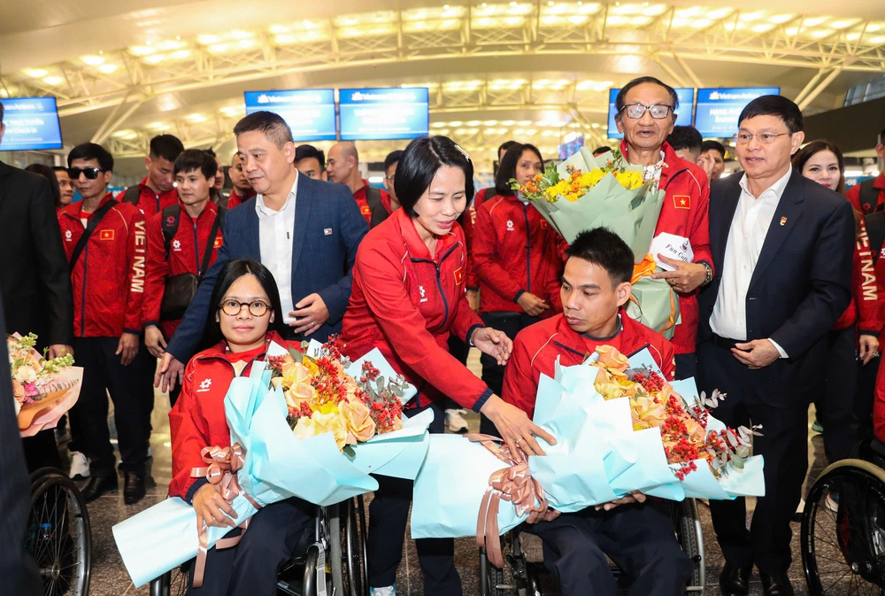 Đoàn thể thao người khuyết tật Việt Nam lên đường dự ASEAN Para Games 13, quyết tâm giành thành tích cao - Ảnh 2.