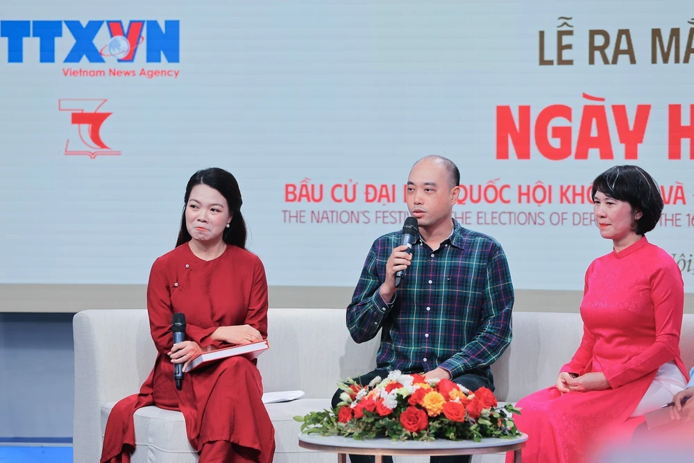 Thông tấn xã Việt Nam ra mắt sách ảnh song ngữ "Ngày hội non sông" - Ảnh 4.