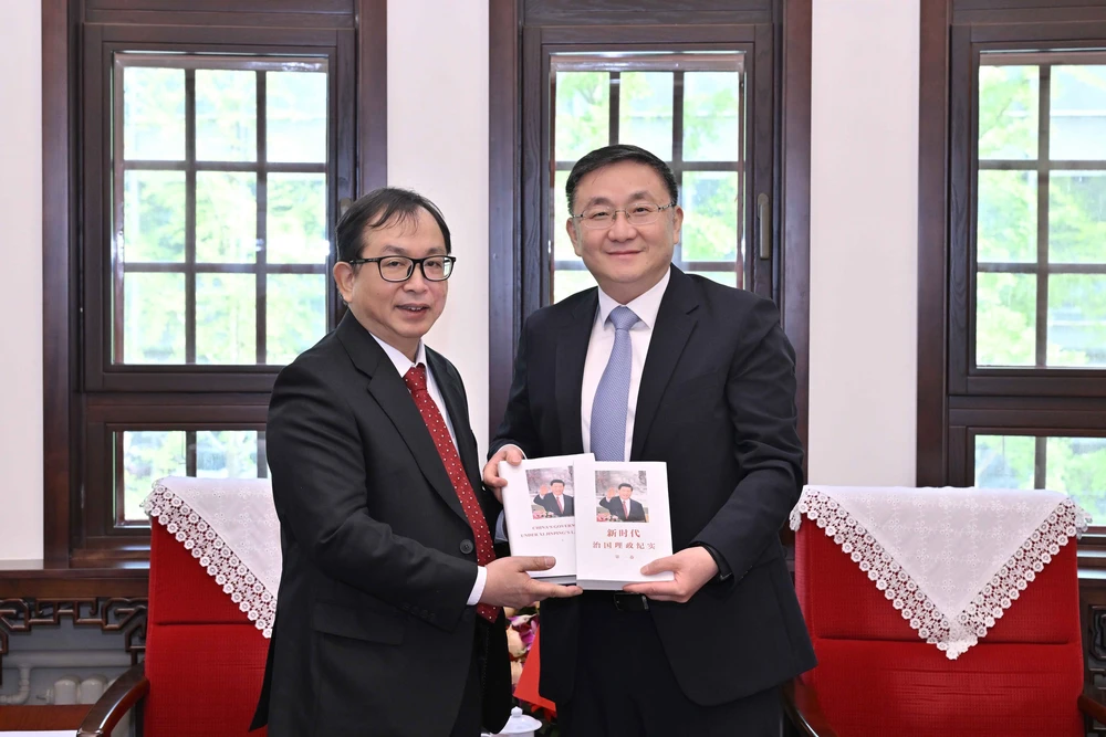 TTXVN và Tân Hoa xã tăng cường hợp tác về chuyển đổi số và ứng dụng công nghệ - Ảnh 2.