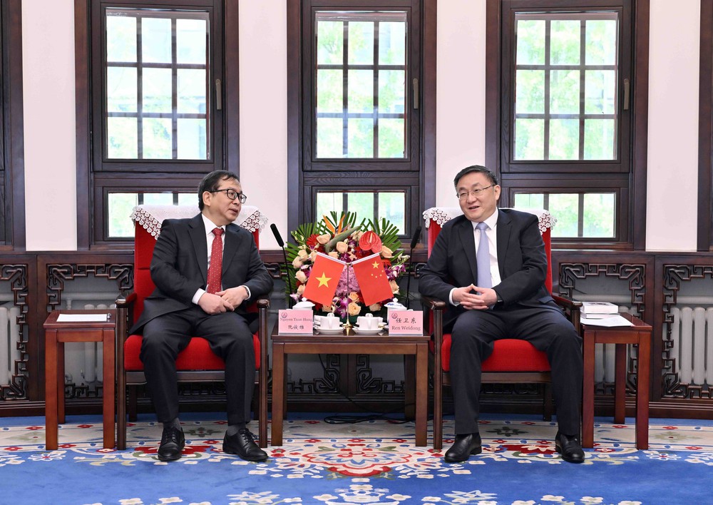 TTXVN và Tân Hoa xã tăng cường hợp tác về chuyển đổi số và ứng dụng công nghệ - Ảnh 1.