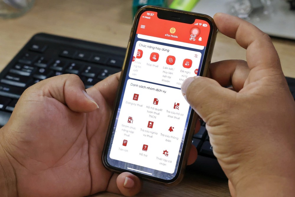 Cục Thuế lấy ý kiến người nôp thuế để hoàn thiện ứng dụng eTax Mobile - Ảnh 1.