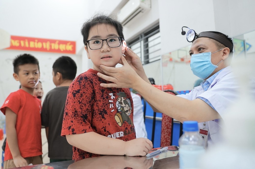 Hà Nội triển khai khám sức khỏe miễn phí cho học sinh trước năm học mới - Ảnh 16.