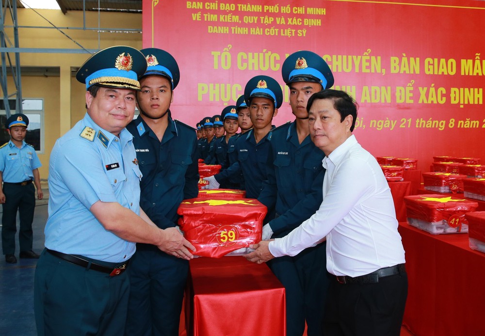 Bàn giao hơn 7.000 mẫu hài cốt liệt sĩ phục vụ giám định ADN - Ảnh 12.
