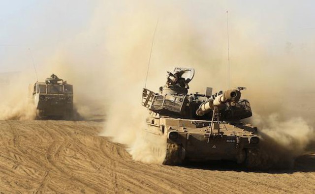 Xe tăng Israel tập trận trên khu vực chiếm đóng thuộc Cao nguyên Golan tháng 9/2017. Ảnh: Reuters