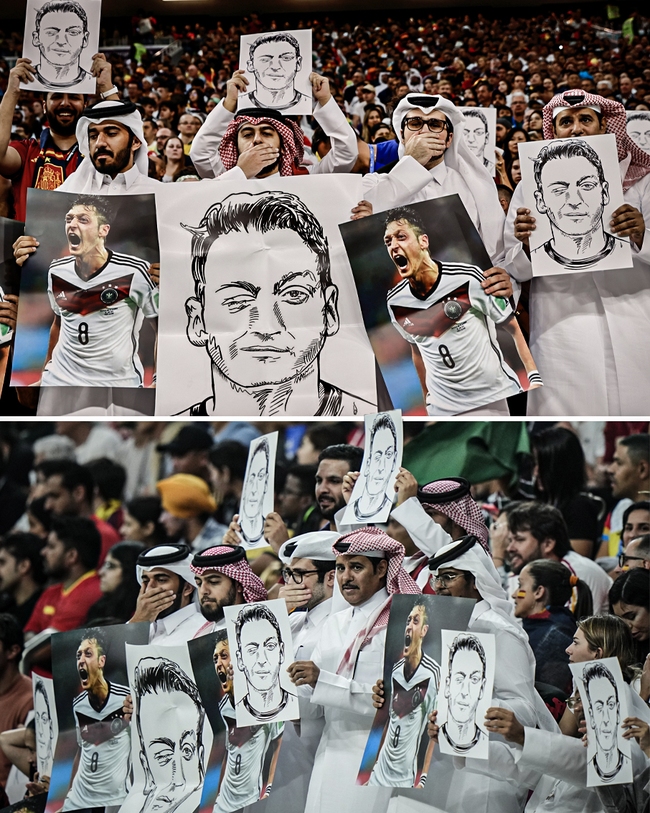 CĐV Qatar chế giễu tuyển Đức bằng ảnh Ozil - Ảnh 1.