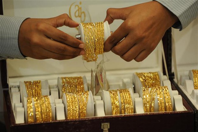 Giá vàng châu Á chạm mức cao nhất của 9 tháng phiên 26/1 - Ảnh 1.