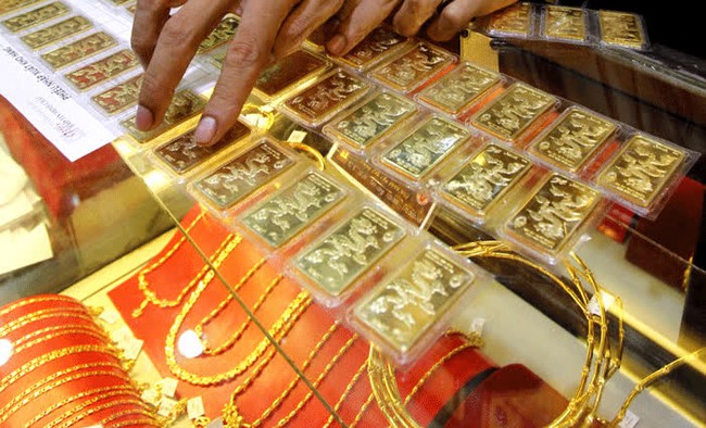  Giá vàng sáng 14/2 giảm 100 nghìn đồng/lượng - Ảnh 1.