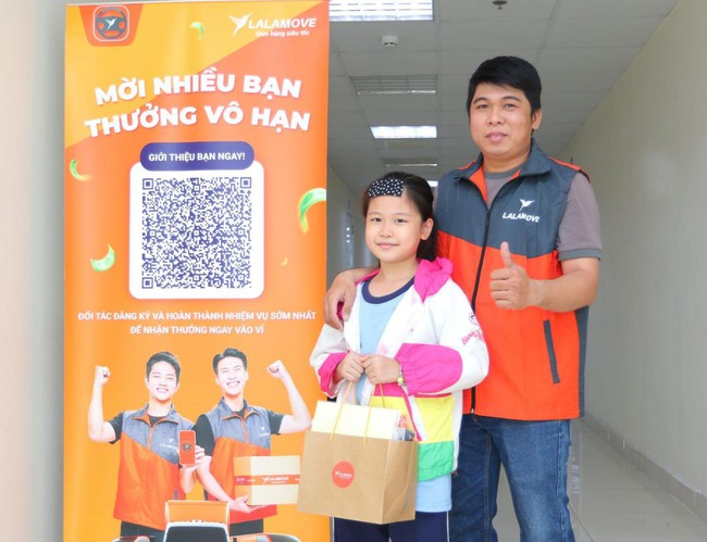 Đối tác tài xế Lalamove cùng gia đình tham dự sự kiện gặp gỡ nhân dịp Năm mới - Ảnh 1.