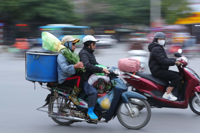 Hình ảnh người dân rời Hà Nội về các tỉnh đón Tết Giáp Thìn  - Ảnh 5.