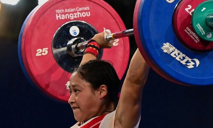 Nữ VĐV cử tạ Triều Tiên gây sốc khi phá 9 kỷ lục liên tiếp - Ảnh 3.