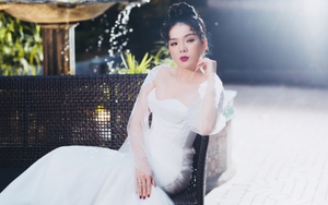Lệ Quyên mặc váy cưới lần hai sau 7 năm lên xe hoa