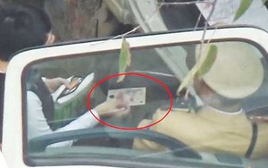 Hà Nội tạm đình chỉ các cảnh sát giao thông nghi nhận tiền 'làm luật'