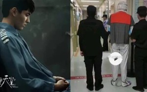 Xôn xao clip mới nhất về Ngô Diệc Phàm: Chân bị xích, cảnh sát hộ tống 2 bên?