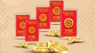 Giá vàng giảm sau thỏa thuận thương mại Mỹ-Anh