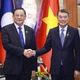 Thủ tướng Lê Minh Hưng gặp Thủ tướng Lào Sonexay Siphandone